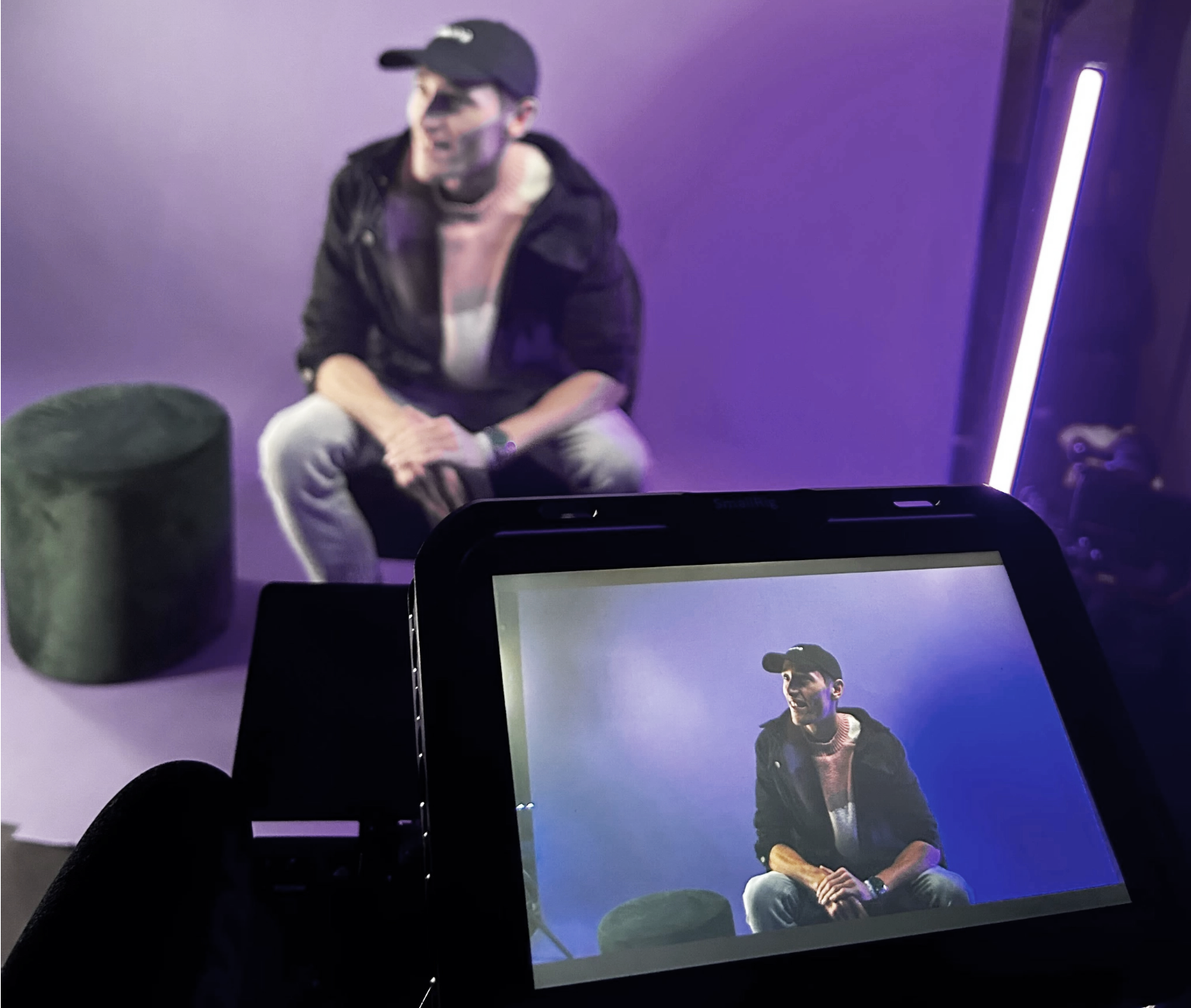 Chris Hartsook on set during a production shoot, with the camera monitor in frame